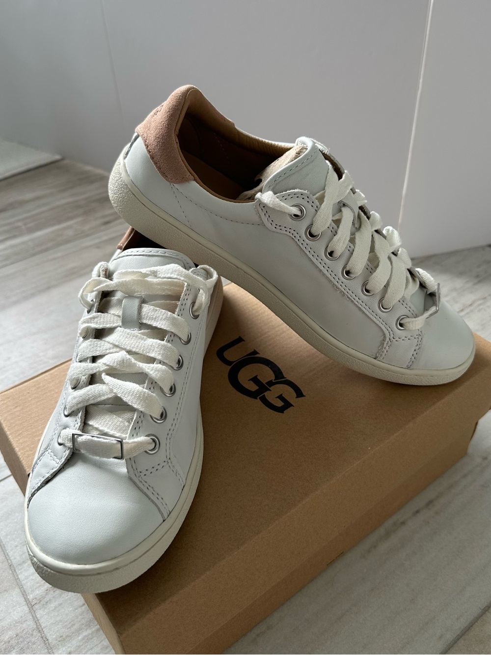 UGG Women's White Leather Sneakers with Tan Heel Detail. New in box.